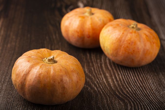 Pumpkins on the wooden table.