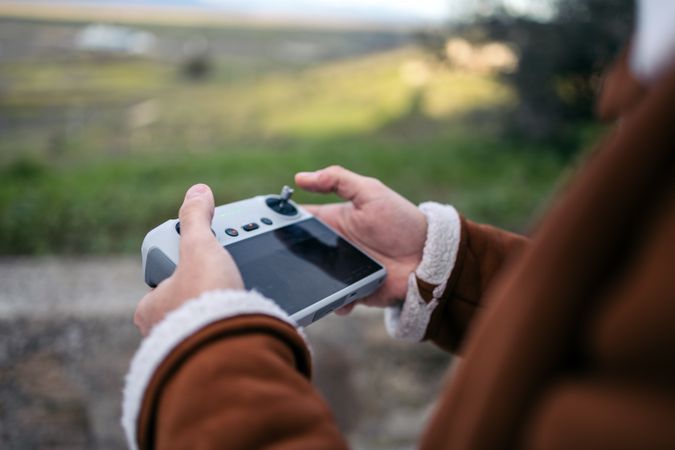 Unrecognizable man controlling a drone