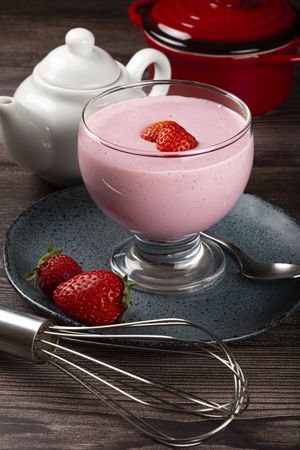 Delicious strawberry mousse in glass goblet.