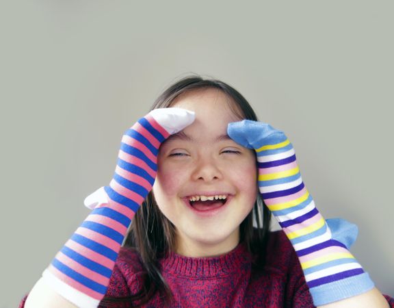 Happy child having fun playing with hand puppets