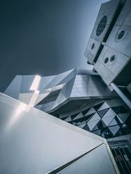 Low angle shot of grey shiny modern buildling