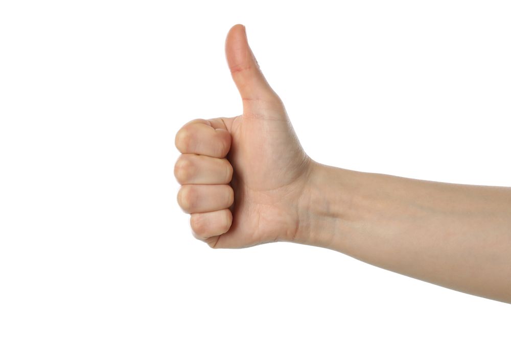 Female hand thumb up, isolated on plain background