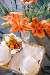Bouquet and tray on table in hotel room