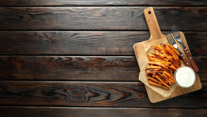 Fried sweet potato on a plate with sauces