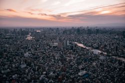 Cityscape under sunset sky