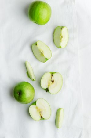 Green apples over cloth