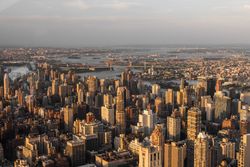 Scenic Aerial New York City Daytime View of Lower Manhattan Architecture. Panoramic Downtown Photo from a Helicopter at Sunset. Cityscape with Modern Office Buildings and Historic Skyscrapers