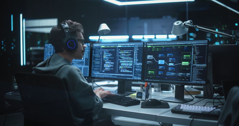 Young Hacker Working Alone, Hacking Corporate Data Servers From His Underground Hideout