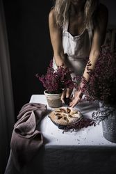 Woman cutting plum cake