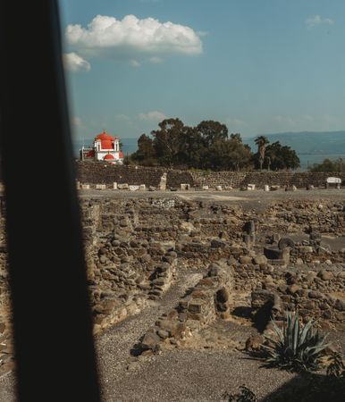 Ancient ruins and church on cloudy day