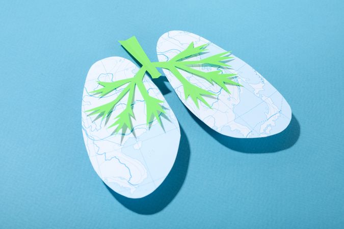 Blue background with lungs with green