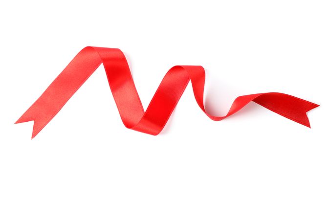 Red ribbon isolated on blank background. Gift concept
