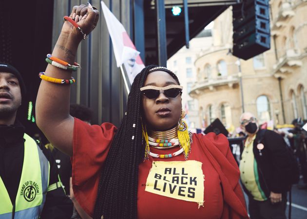 London, England, United Kingdom - March 19 2022: Black woman with raised fist at anti-racism rally