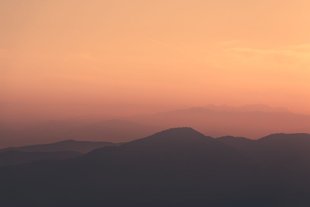 Sunset sky over mountain ridge