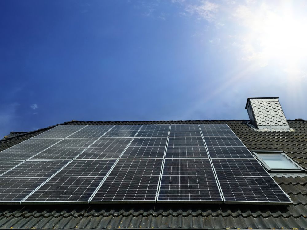 Solar panels producing clean energy on a roof of a residential house