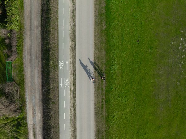 Aerial photo of two persons enjoying a summer day on their bikes.