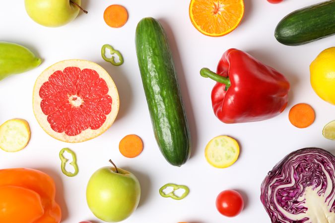 Different vegetables and fruits on blank background, top view