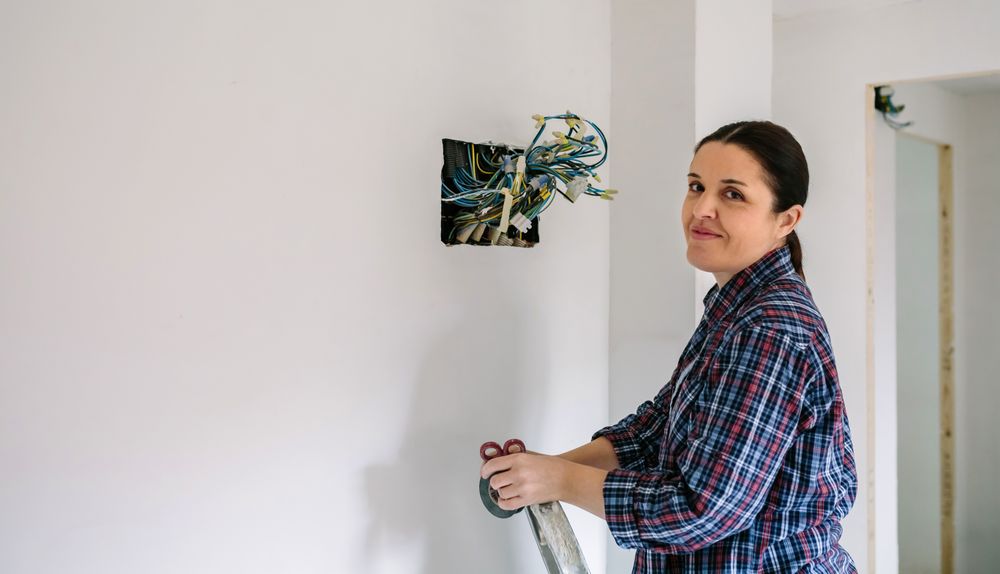 Electrician working on the electrical installation of a house