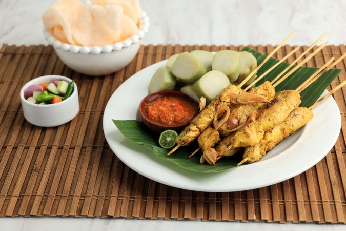 Sate Ayam or Chicken Satay with Lontong and Kerupuk
