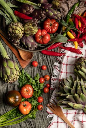 Assorted vegetables and napkins on table