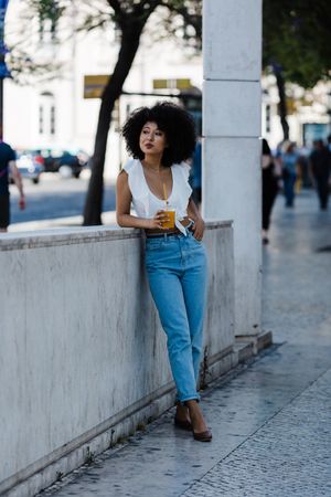 Young female enjoying refreshing drink