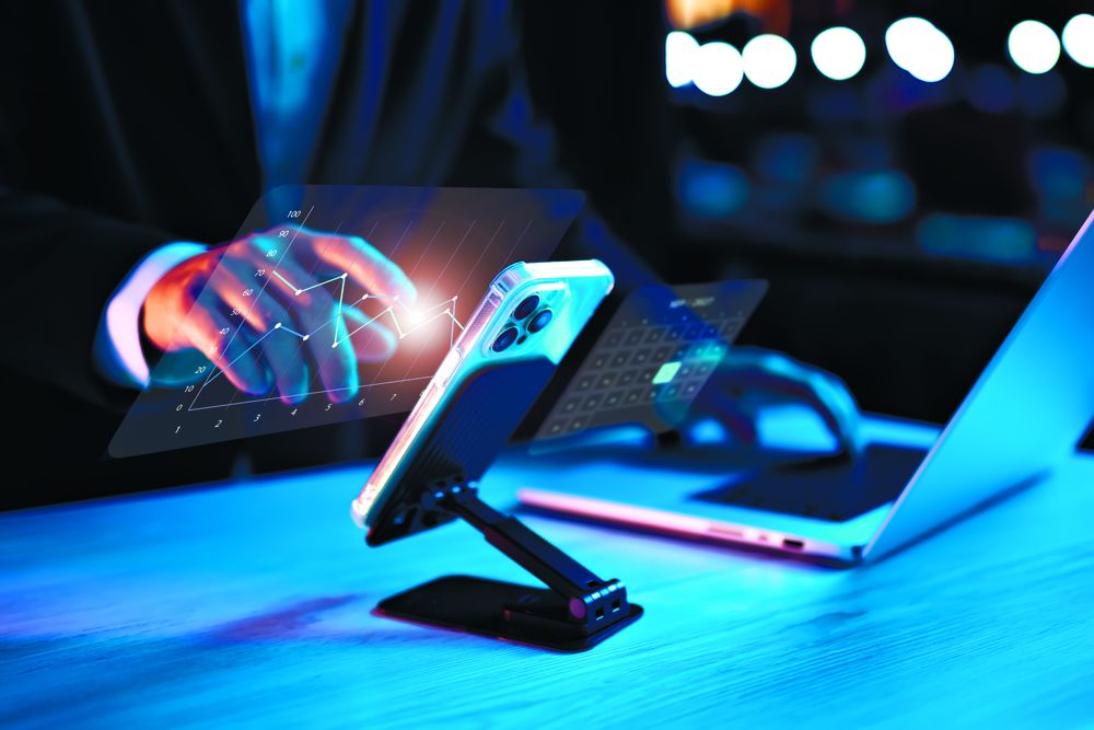 Business strategy using smartphone and laptop