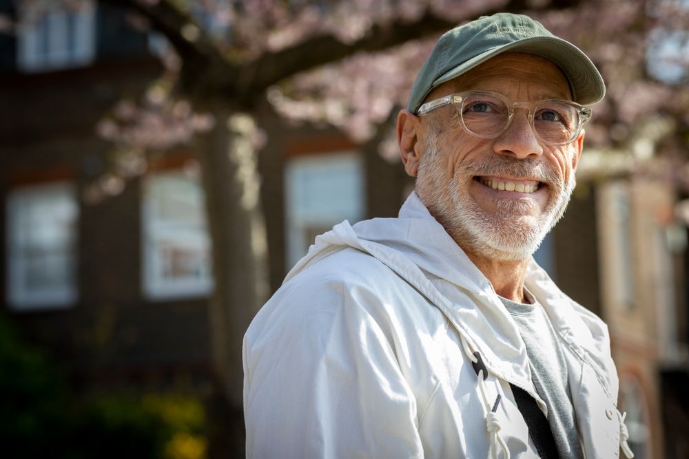 Portrait of smiling male with grey beard in the spring