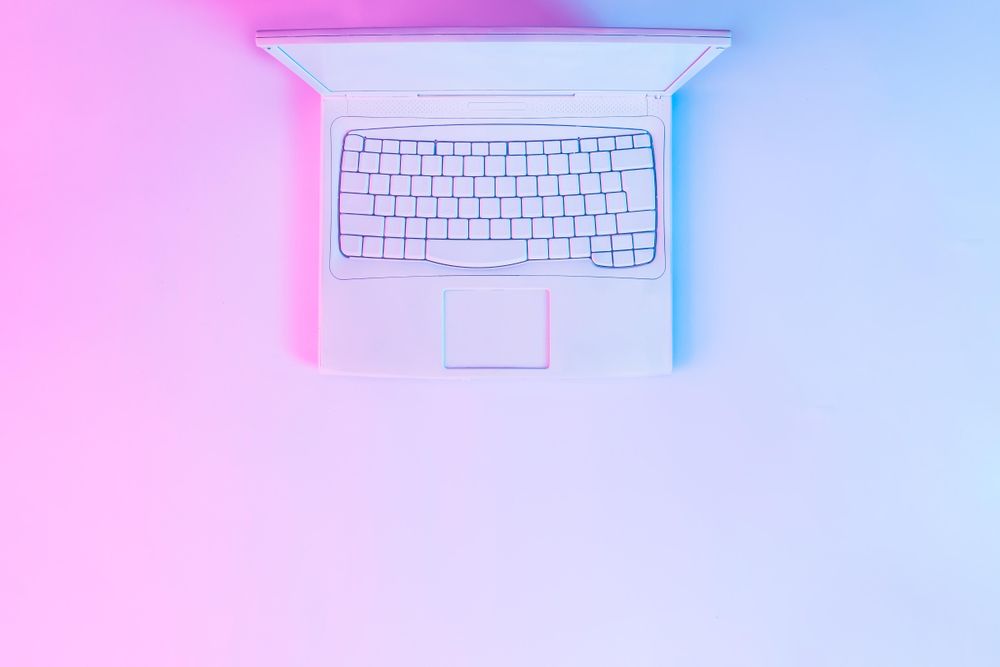 Laptop with vibrant bold gradient holographic lights