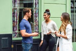 Multiracial group of friends talking outside