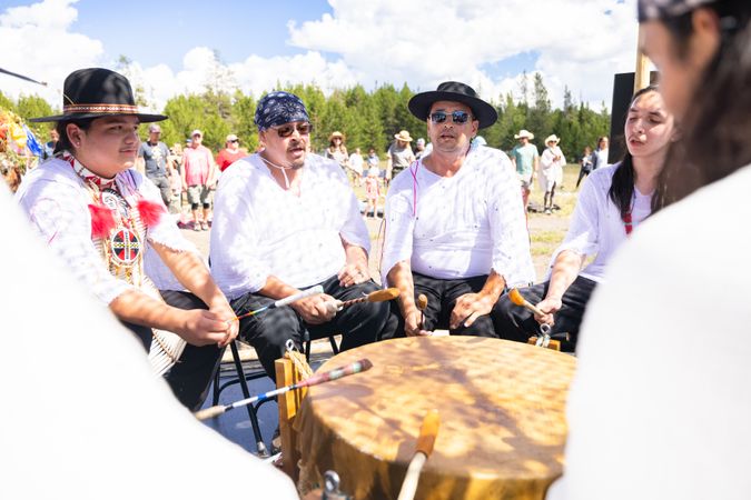 Montana, United States - August 17, 2022: Native people participating in drum circle at Yellowstone