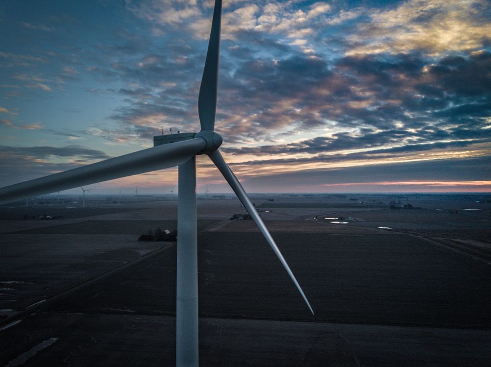 Close-up shot of wind turbine at sunset