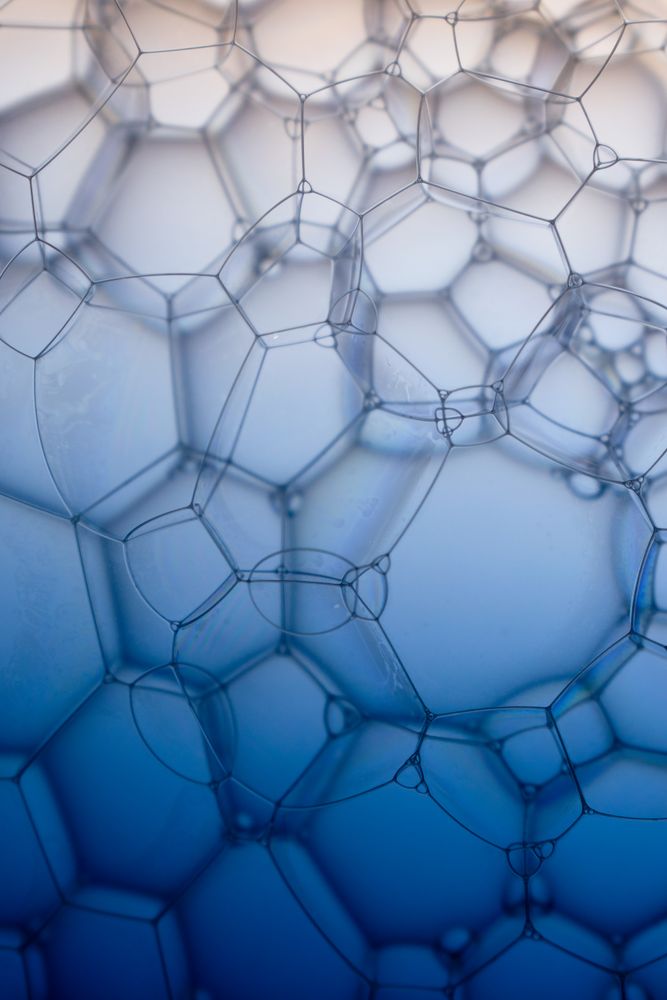 Abstract background bio technology, macro photography foam and water with gradient background. Molecule multicolor backgorund