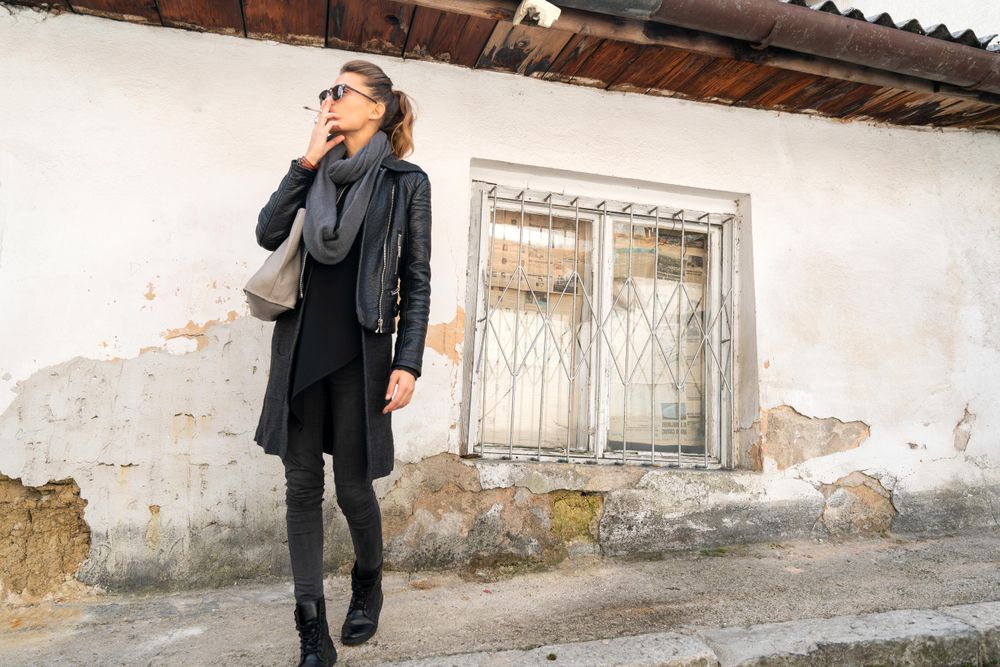 Woman smoking in the street