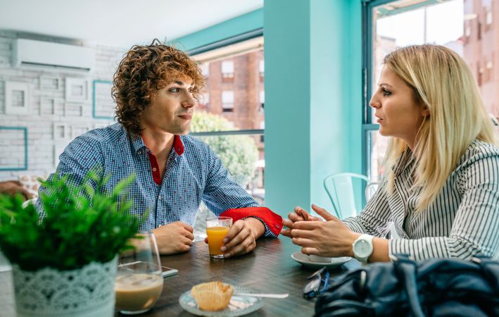 Couple eating breakfast at a cafe