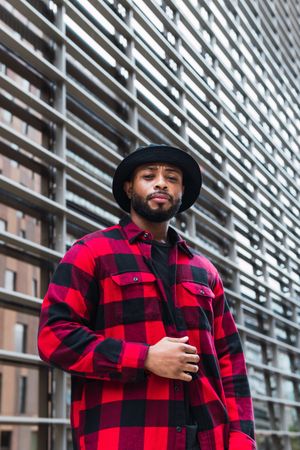 Black man in stylish outfit on street