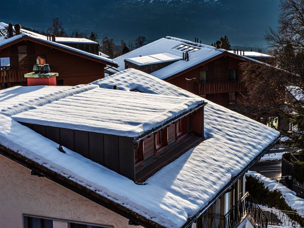 Swiss Alps winter landscape with snow and sun, mountains in Europe