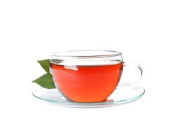 Cup of tea and leaves isolated on plain background