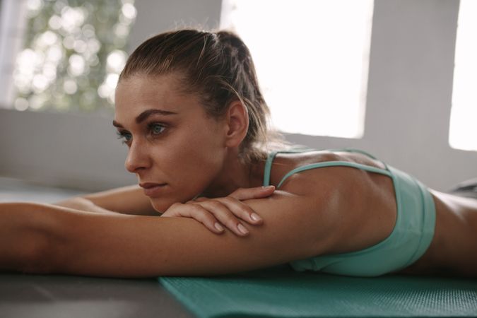 Fit young woman taking rest after workout