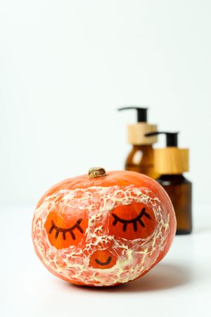 Skin care and face care concept - pumpkin cosmetic
