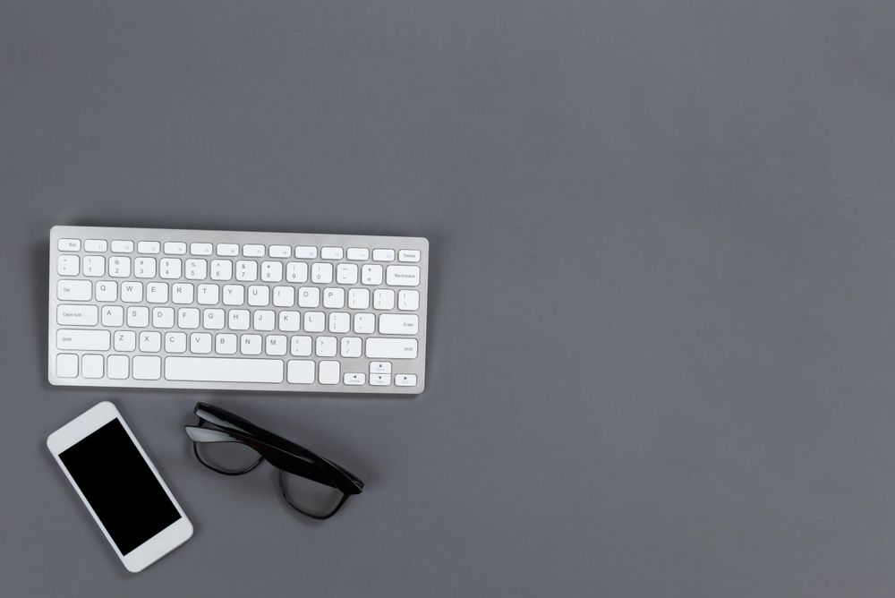 Modern tech stuff on gray desktop