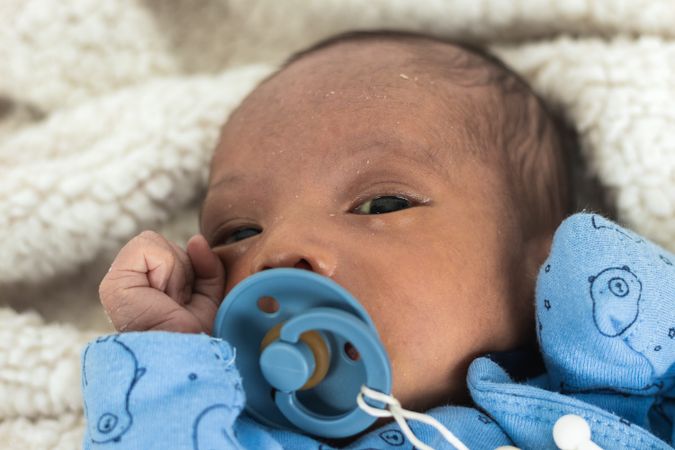 Newborn baby on soft blanket