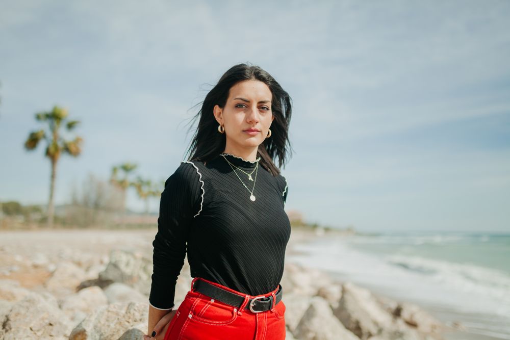 woman at sea looking at camera