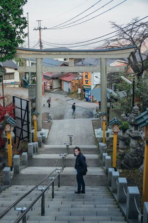 Woman standing on an outdoor staircase in Tokyo, Japan