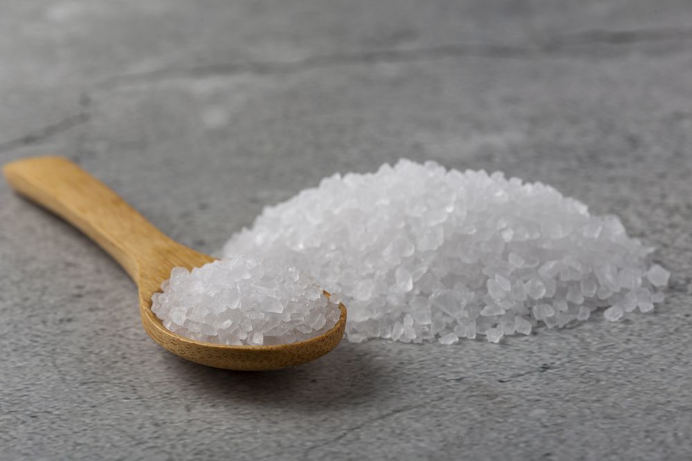 Handful of coarse salt on the table.
