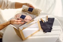 Woman with delivered ingredients for ramen