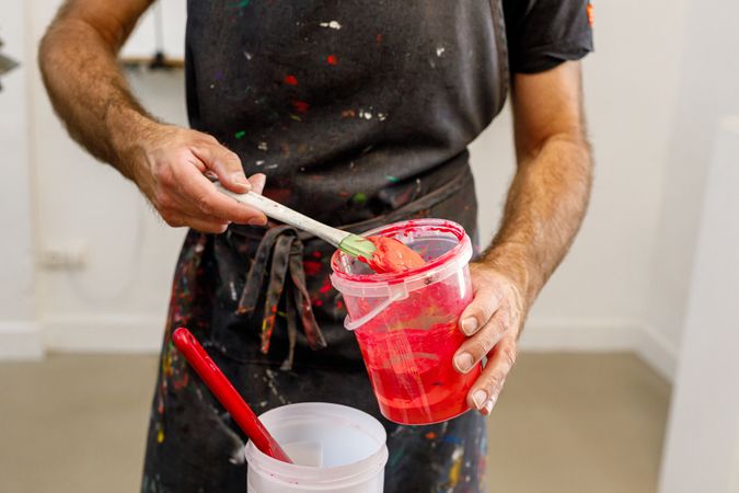 male artist preparing paints