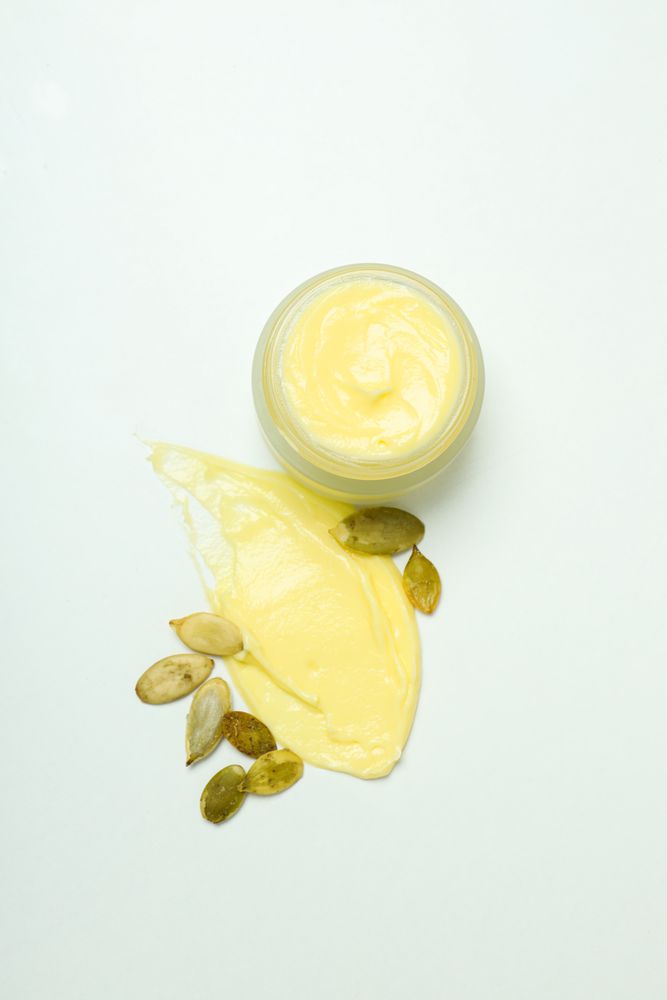 Skin care and face care concept - pumpkin cosmetic