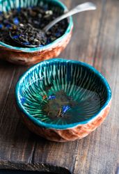 Loose leaf tea served in teal cup