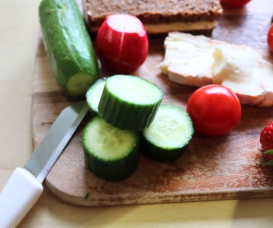 Close view on a healthy german breakfast with sandwiches, tomatoes and cucumbers
