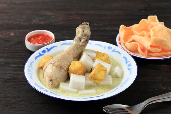 Lontong Opor Ayam Tahu, Indoensian Rice Cake with Curry and Fried Tofu.